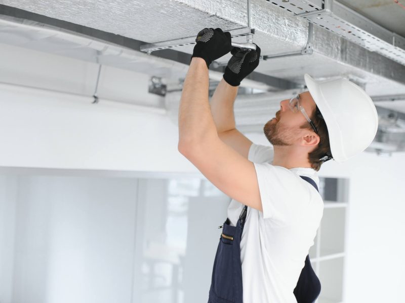 ventilation-system-installation-and-repair-service-hvac-technician-at-work-banner-copy-space.jpg
